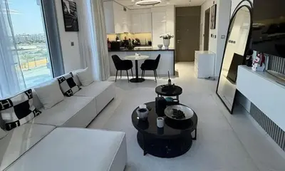 a living room with white couches and a table at Upscale Burj Vista Downtown Stays with Burj Khalifa View in Dubai