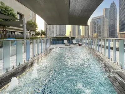 a swimming pool on the roof of a building at Elite Burj Vista Downtown Dubai Apartments with Burj Khalifa View in Dubai