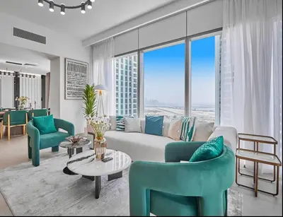 a living room with a couch and chairs and a table at Premium Burj Vista Downtown Apartments with Burj Khalifa View in Dubai