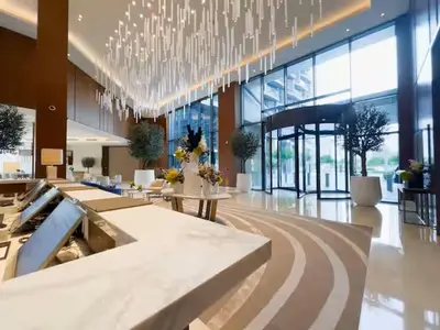 a large lobby with a chandelier in a building at Vogue Downtown Address Residence near Burj Khalifa and Dubai Mall, Two Bedroom Apartment with Balcony and City Skyline view, Access to all Amenities in Dubai