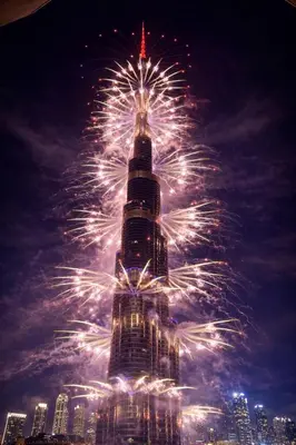 a fireworks display in front of the burj khalifa at Grand Burj Vista Downtown Apartment with Burj Khalifa View in Dubai