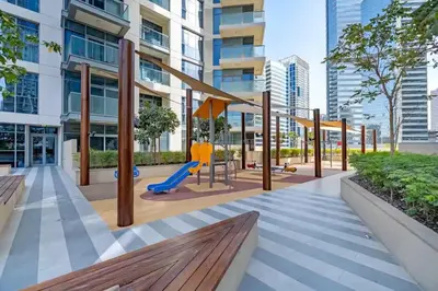 a playground in a building with a slide at Vogue Downtown Bellevue Towers near Burj Khalifa and Dubai Mall, One bedroom Apartment with Balcony and City view, Access to all Amenities in Dubai
