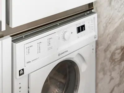 a white washer and dryer in a room at Large modern STUDIO in STERLING DOWNTOWN I DUBAI MALL I Sleeps 4 I Amazing Balcony in Dubai