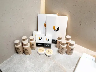 a group of bottles on a table next to a box at Luxury Studio with Private Jacuzzi & Balcony Trillionaire Residences 4 Guests in Dubai