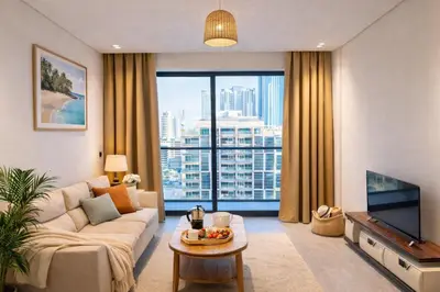 a living room with a couch and a large window at Near World Trade Center Sleeps 5 Family Business Friendly in Dubai