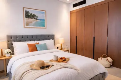 a bedroom with a bed with a hat on it at Near World Trade Center Sleeps 5 Family Business Friendly in Dubai