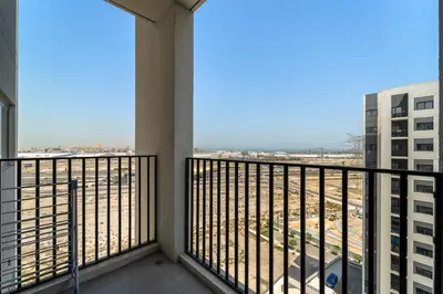 a balcony with a view of a city at Modern & Cozy 2BR Apartment at The Nook 1 Near Metro in Dubai