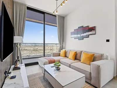 a living room with a couch and a table at Charming 2BDR Stay in Binghatti Corner- JVC in Dubai