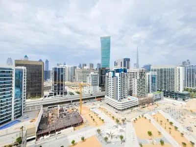 an aerial view of a city with tall buildings at DAMAC CAPITAL BAY - Blueocean Holiday Homes in Dubai