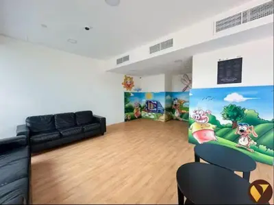 a living room with a black couch in a room at Vogue JLT Global Lake View Tower near Marina and JBR, Two Bedroom Apartment with Balcony and City view, Access to all Amenities in Dubai