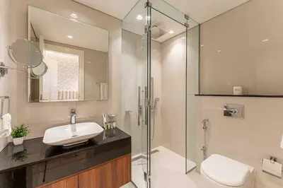 a bathroom with a sink and a shower at HAVN- 3 bedroom in DAMAC Majestine, Business Bay in Dubai
