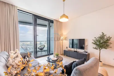 a living room with a couch and a large window at Sea View, Direct Beach Access - The Address Residences, JBR by Deluxe Holiday Homes in Dubai