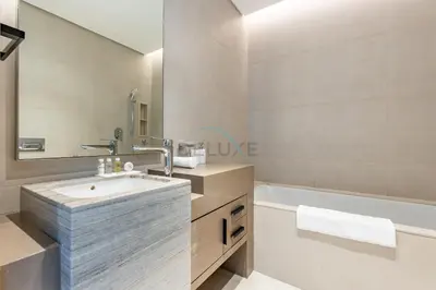 a bathroom with a sink and a bath tub at Sea View, Direct Beach Access - The Address Residences, JBR by Deluxe Holiday Homes in Dubai