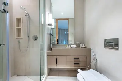 a bathroom with a shower and a sink at Sea View, Direct Beach Access - The Address Residences, JBR by Deluxe Holiday Homes in Dubai