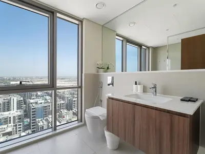 a bathroom with a sink and a large window at Opulent Haven 2BDR w Sofa Bed Sleeps 6 In Vida-02 in Dubai