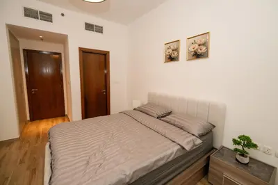a bedroom with a large bed in a room at Skyline & Islands View 3BR Luxe Top Floor Noura Tower Business Bay in Dubai