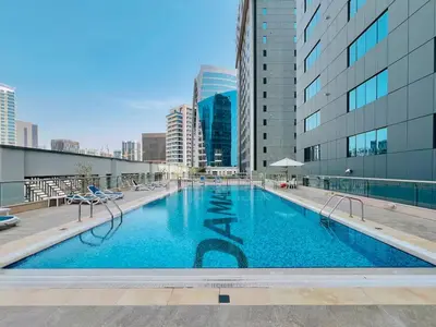 a swimming pool on the roof of a building at HAVN- High floor 1 bedroom in Business Bay in Dubai