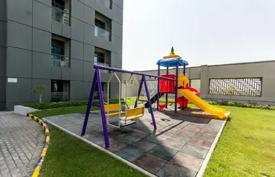 a playground in a yard next to a building at HAVN- High floor 1 bedroom in Business Bay in Dubai