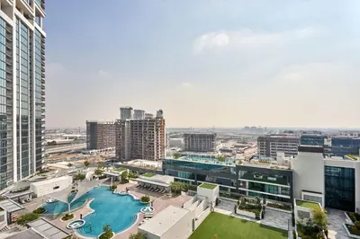 an aerial view of a city with a pool at Frank Porter - The Crest Tower, Sobha Hartland in Dubai