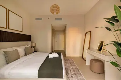 a bedroom with a large bed in a room at 4BR - Stunning Burj View - Dubai Mall Access in Dubai