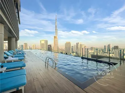 a swimming pool on top of a building with a city at Paramount 10 Min to Dubai Mall, Luxury Amenities in Dubai