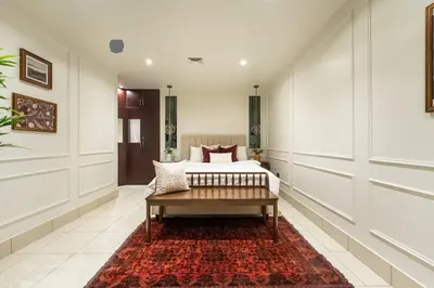 a bedroom with a bed and a rug at Burj Khalifa 2 BR apartment in the down town in Dubai