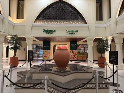 a shopping mall with a large vase in the middle at Burj Khalifa 2 BR apartment in the down town in Dubai