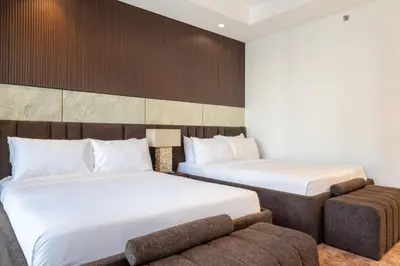 a hotel room with two beds and a couch at Burj Khalifa View, Luxury 2B, Top Amenities and Equipment in Dubai