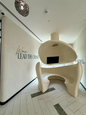 a toilet in a room with a wall with words lead the charge at Burj Khalifa View, Luxury 2B, Top Amenities and Equipment in Dubai