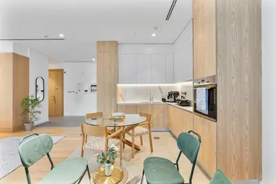 a kitchen and dining room with a table and chairs at Serene Studio in Al Barari Near Dubai Hills Mall in Dubai