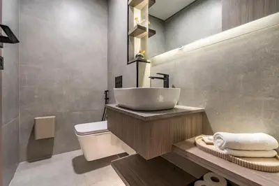 a bathroom with a sink and a toilet at GuestReady | New 1BR with Maid’s Room | Spacious in Dubai