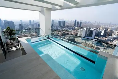 a swimming pool on the top of a building at LAREDA BY VIBY Vacation Homes Rental in Dubai
