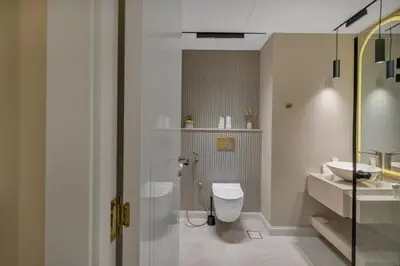 a bathroom with a toilet and a sink at Luxe 2 Bedroom Apartment in Dubai Marina in Dubai