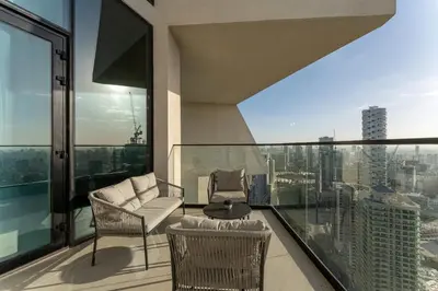 a balcony with a view of a city at HAVN - High floor 1BR with Private Sky Pool, JVC in Dubai
