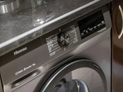 a close up of a washer and dryer at Livin' Holidays - 2 BR - Anantara Beach View in Dubai