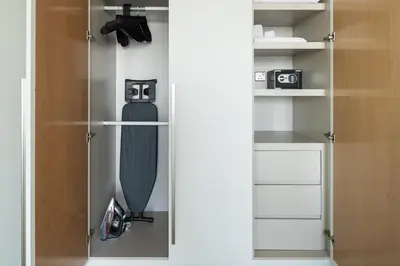 a closet with a skateboard sitting inside of it at BurjKhalifaViews,1BHK, High Floor, Damac Paramount Tower B in Dubai