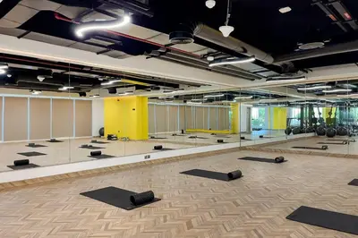 a room with a lot of mirrors and yoga mats at Chic Studio in Me Do Re JLT YOLO in Dubai