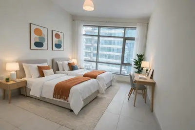 a bedroom with two beds and a large window at Downtown Three Beds near to Burj Khalifa and Dubai Mall in Dubai