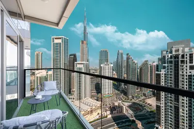 a balcony with a view of the city at Restay Homes at Paramount Midtown Hotel - Infinity pool access included in Dubai