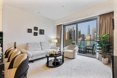 a living room with a couch and a table at Luxury 1 Bed in Marina Mall JW Marriot in Dubai