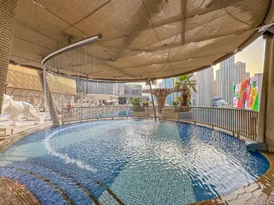 a large swimming pool on top of a building at Luxury 1 Bed in Marina Mall JW Marriot in Dubai
