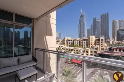 a balcony with a view of a city skyline at Vogue Downtown Burj Residence Near Dubai Mall and Burj Khalifa, Three Bedroom Plus Maid's room Apartment with Balcony and City View, Access to all Amenities in Dubai