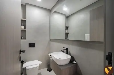 a bathroom with a sink and a toilet and a mirror at Vogue JVC Al Serh Residences Near Circle Mall, One Bedroom Plus Maid's room Apartment with Balcony and City View, Access to all Amenities in Dubai