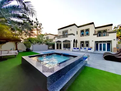 a large house with a swimming pool in the yard at Royal Palazzo with private Pool and BBQ on Marina, huge 7Bedroom Villa in Dubai