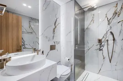 a bathroom with a sink and a toilet and a shower at Jasmine Lane, JGE - 3 Bedroom with maids' room Townhouse - Allsopp & Allsopp in Dubai
