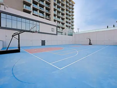 a basketball court in front of a building at Bright & Spacious 2-Bedroom Apartment Al furjan-706 in Dubai