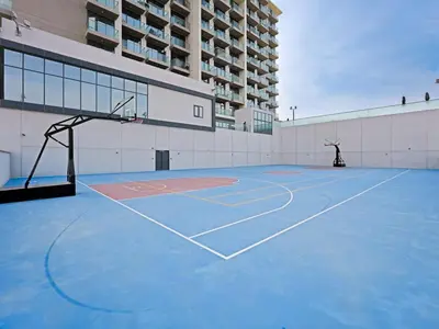 a basketball court in front of a building at Comfortable 2-Bedroom Home in Al Furjan-607 in Dubai