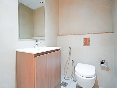 a bathroom with a toilet and a sink at Elegant 1-Bedroom Apartment in Al Furjan-G01 in Dubai
