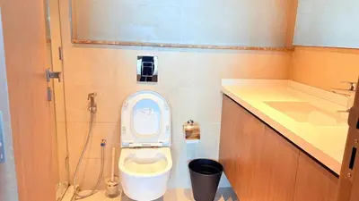 a small bathroom with a toilet and a sink at Ready-to-Move 1-Bedroom in Al Furjan-103 in Dubai