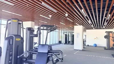 a gym with cardio equipment in a building at Ready-to-Move 1-Bedroom in Al Furjan-103 in Dubai